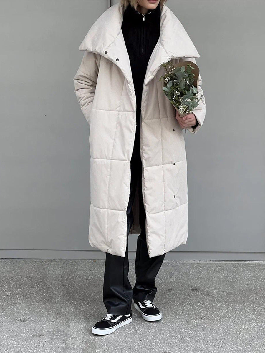 Long padded winter coat with a wide lapel and tie waist