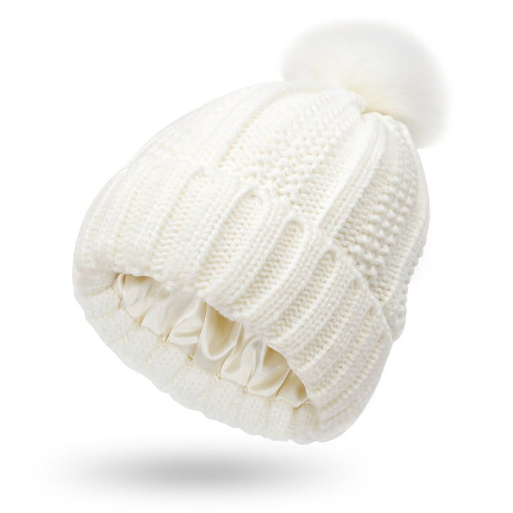 Knit beanie with faux fur pom pom