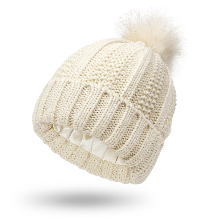 Knit beanie with faux fur pom pom