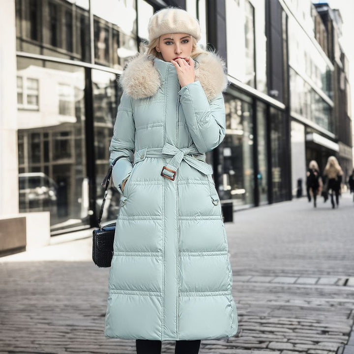 Long belted winter coat with a faux fur hood and slim fit