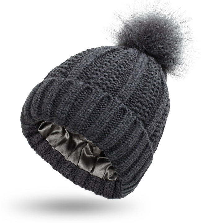 Knit beanie with faux fur pom pom