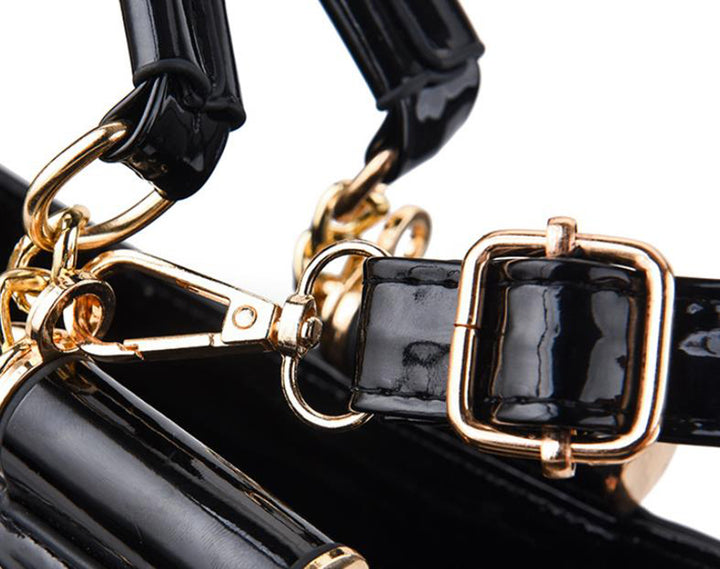 Sequin embroidered patent leather handbag