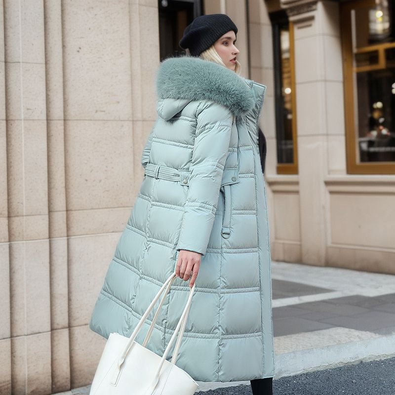 Long belted winter coat with a faux fur hood and slim fit
