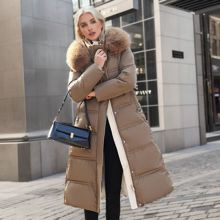 Long belted winter coat with a faux fur hood and slim fit