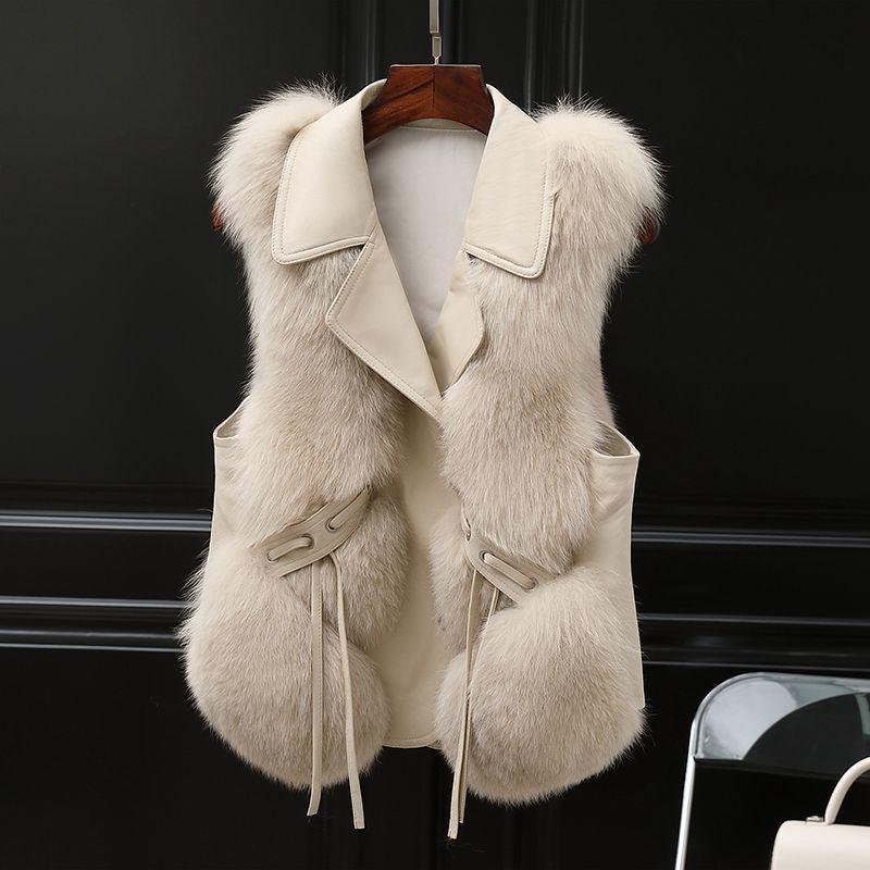 Woman in a short faux fur vest