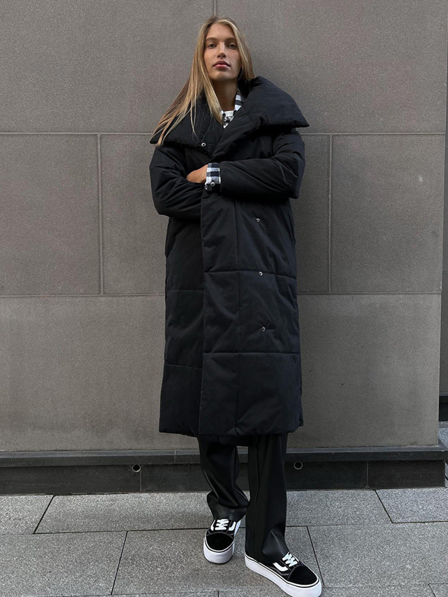 Long padded winter coat with a wide lapel and tie waist
