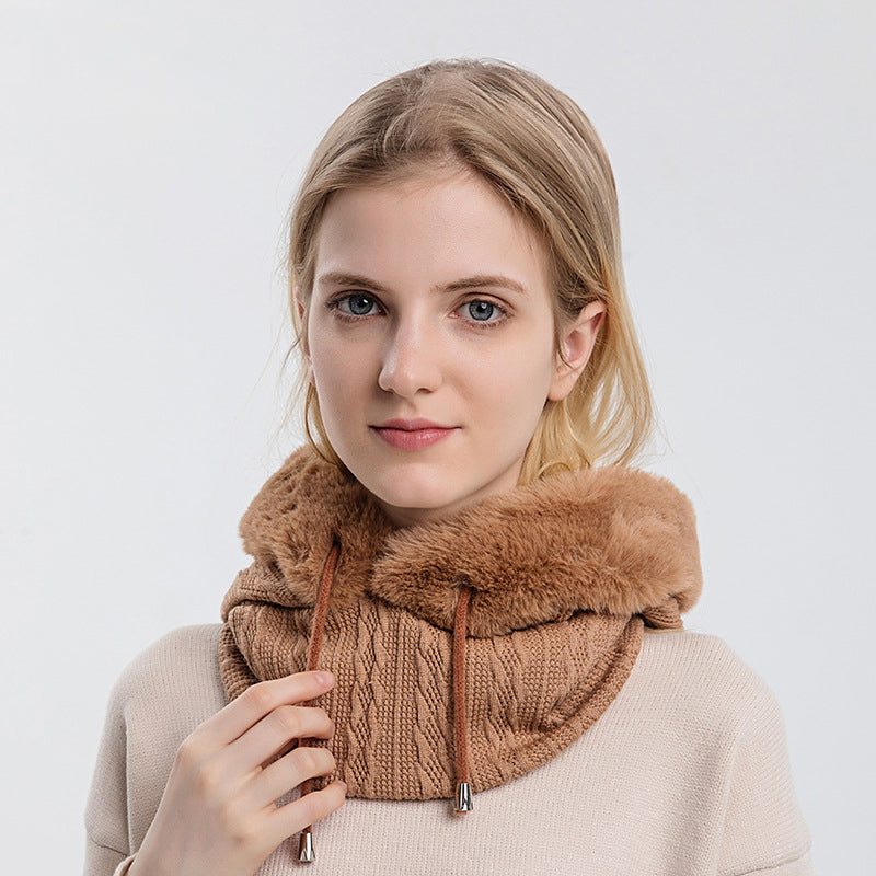 Woman wearing knit hood with faux fur trim