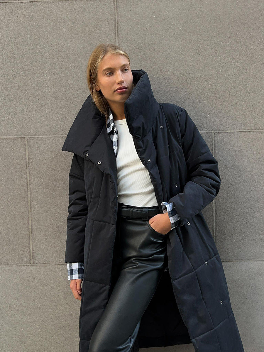 Long padded winter coat with a wide lapel and tie waist