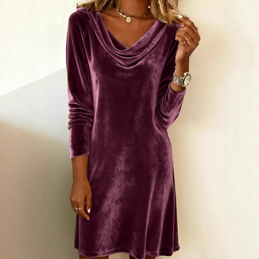 Woman in a velvet cowl neck mini dress