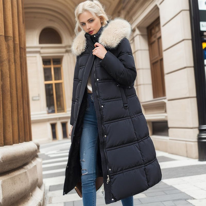 Long belted winter coat with a faux fur hood and slim fit