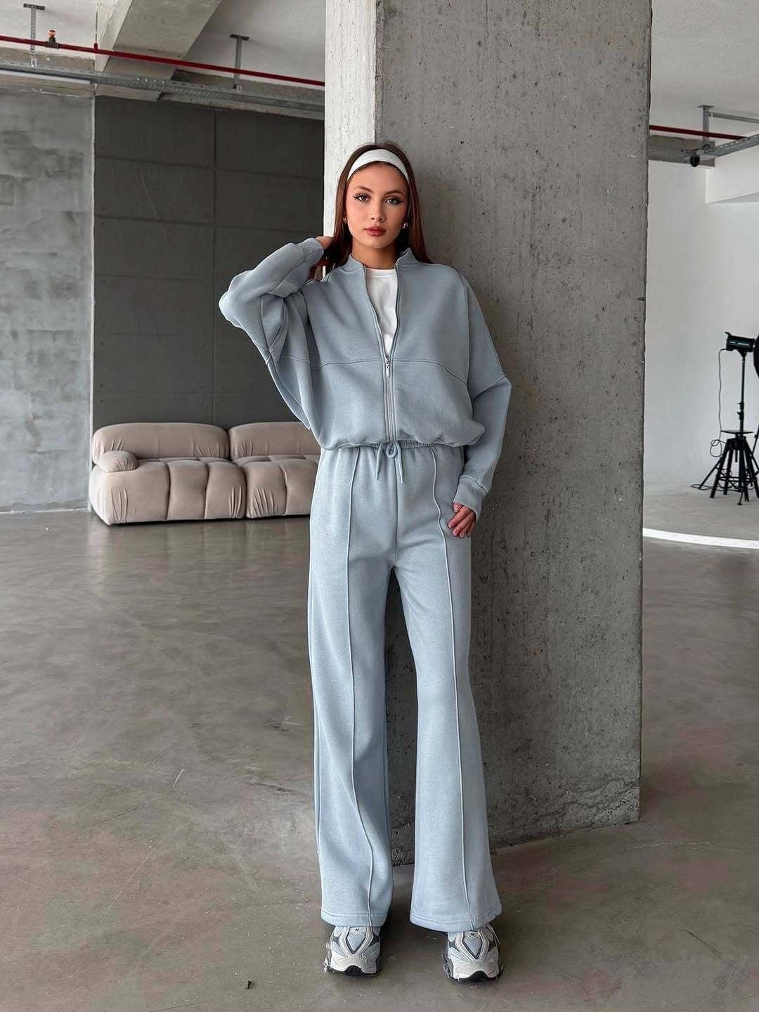 Woman in a zip jacket and wide-leg pants set
