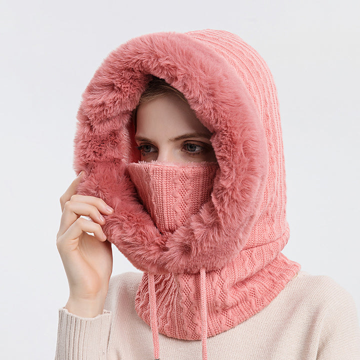 Woman wearing knit hood with faux fur trim