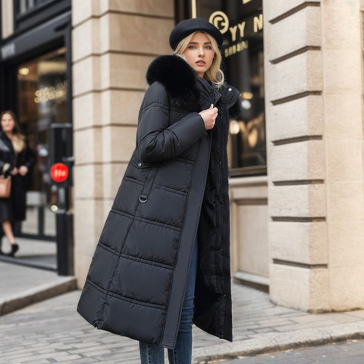 Long belted winter coat with a faux fur hood and slim fit